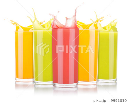 tasty summer fruit drinks in glass with splash 9991050