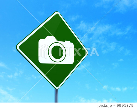 Vacation concept: Photo Camera on road sign background 9991379