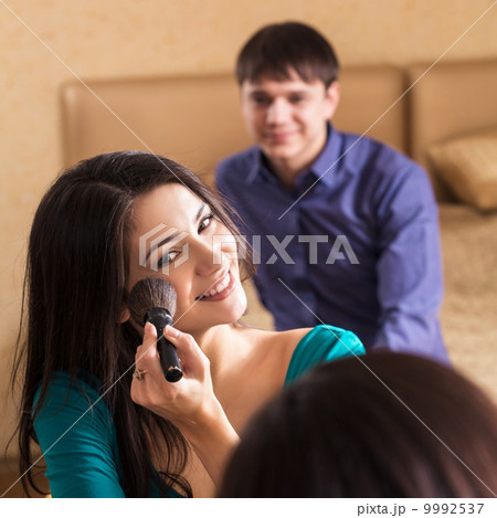Beautiful woman putting make up Beautiful woman putting make up 9992537