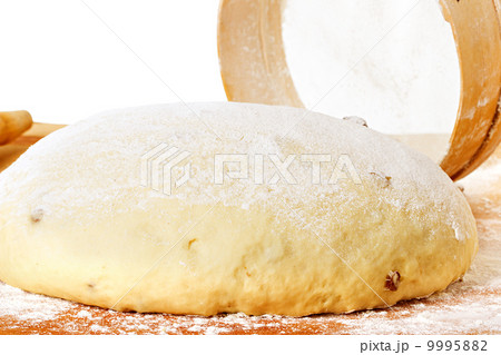 dough with rolling pin on floured table top view dough with rolling pin on floured table top view 9995882
