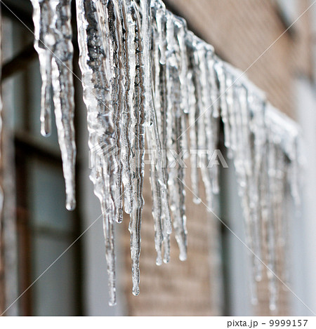 icicles which are hanging down from a roof icicles which are hanging down from a roof 9999157