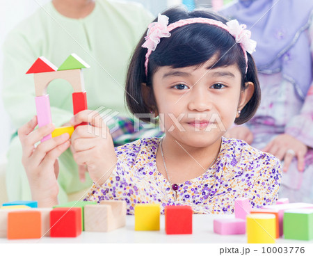 Child building wooden house Child building wooden house 10003776