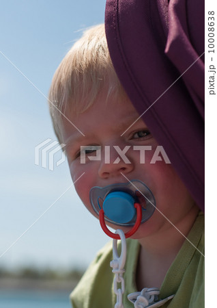 Portrait of baby with pacifier 10008638