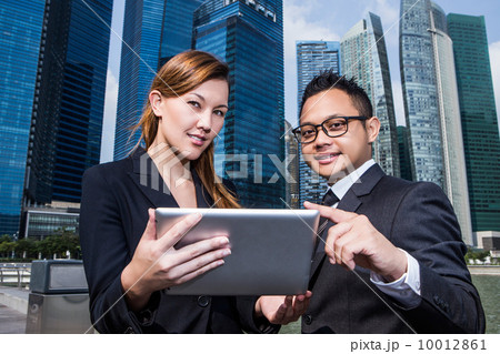 Young business executives discussion with a tablet pc 10012861