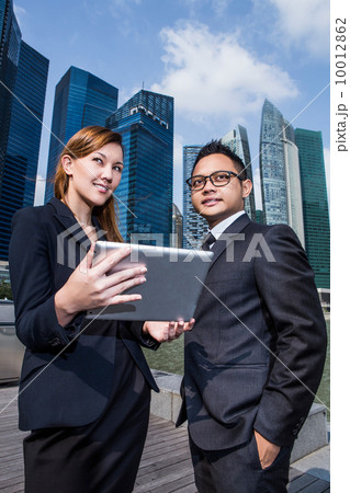 Young business executives discussion with a tablet pc 10012862