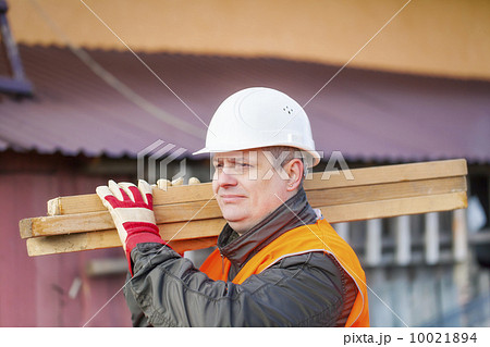 Carpenter with boards on their shoulders 10021894