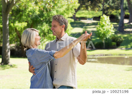 Couple dancing in countryside Couple dancing in countryside 10025196