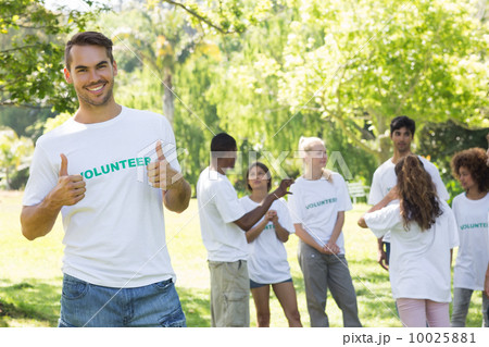 Handsome volunteer showing thumbs up 10025881