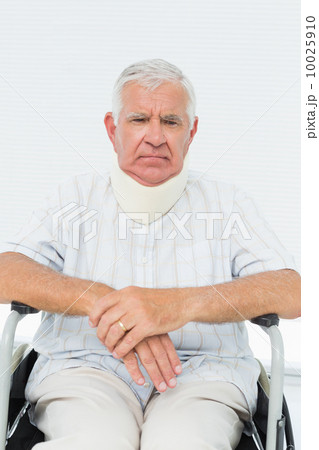 Senior man sitting in wheelchair with cervical collar Senior man sitting in wheelchair with cervical collar 10025910