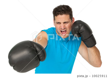 Determined male boxer focused on his training Determined male boxer focused on his training 10025911