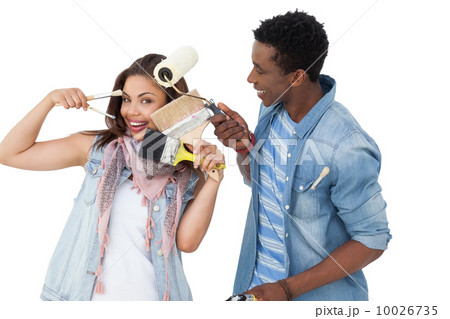 Portrait of a happy couple with painting tools Portrait of a happy couple with painting tools 10026735