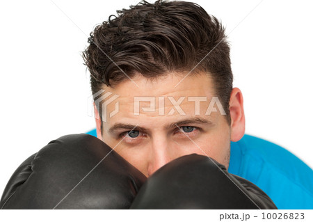 Close-up of a determined male boxer focused on training 10026823