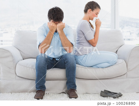 Couple on the couch after an argument Couple on the couch after an argument 10026890