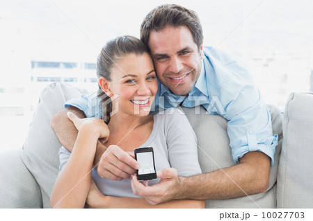 Smiling woman being surprised by a marraige proposal Smiling woman being surprised by a marraige proposal 10027703