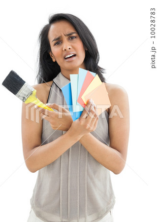 Portrait of a woman with paint samples and paintbrush 10028783