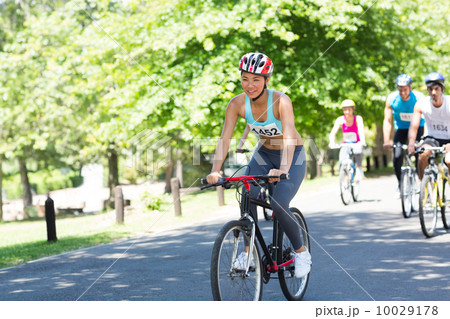 Cyclists riding bicycles 10029178