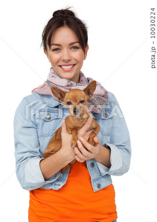 Portrait of a smiling young woman with pet dog Portrait of a smiling young woman with pet dog 10030224
