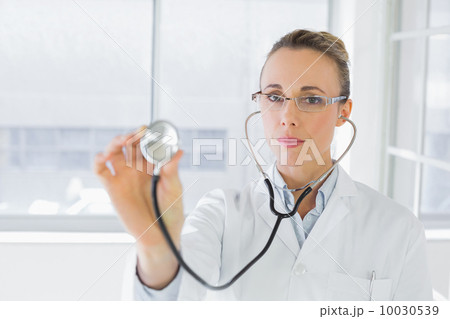 Portrait of a female doctor with stethoscope Portrait of a female doctor with stethoscope 10030539