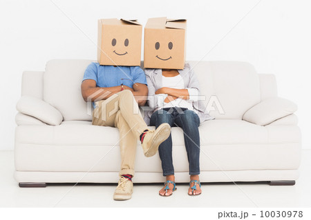 Young couple with happy smiley boxes over faces Young couple with happy smiley boxes over faces 10030978