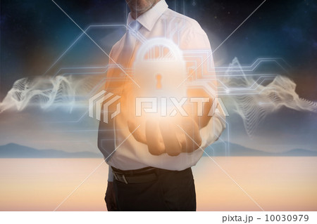 Businessman presenting lock graphic Businessman presenting lock graphic 10030979