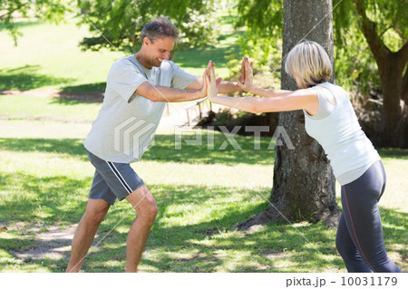 Couple working out in the park Couple working out in the park 10031179