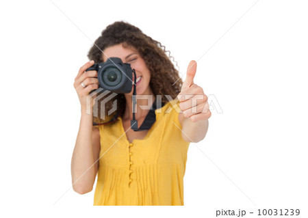 Female photographer gesturing thumbs up Female photographer gesturing thumbs up 10031239