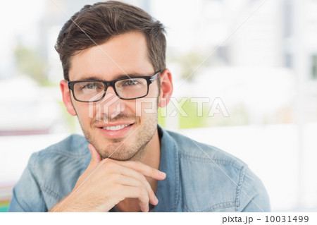 Casual male photo editor at a bright office Casual male photo editor at a bright office 10031499