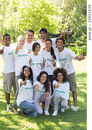 Volunteers showing thumbs up in park 10031636