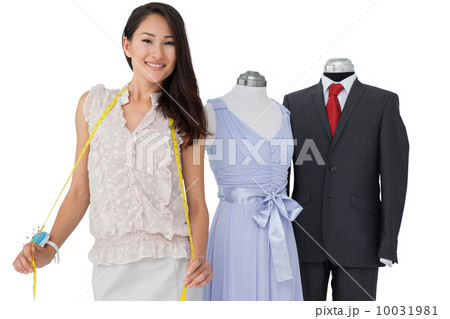 Portrait of a female fashion designer and mannequins 10031981