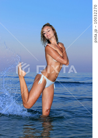 young woman topless in water 10032270