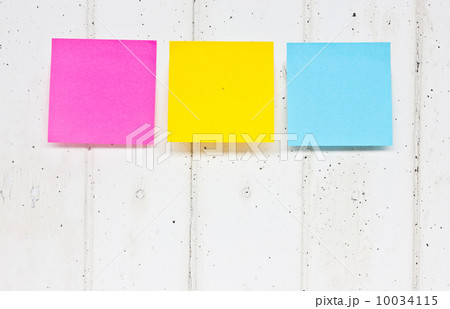 colorful sticky notes on old wooden board colorful sticky notes on old wooden board 10034115