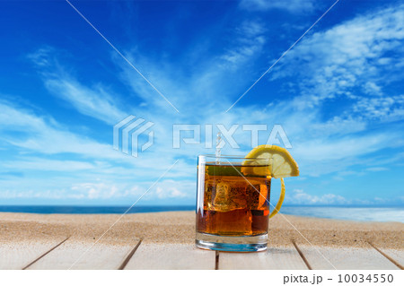 Cuba libre cocktail on the deck 10034550