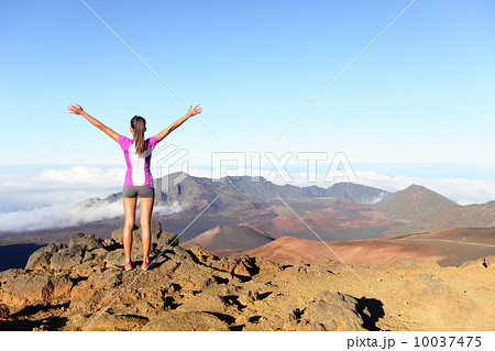 Hiking woman on top happy and celebrating success 10037475