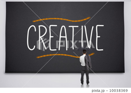Businessman reading the word creative 10038369