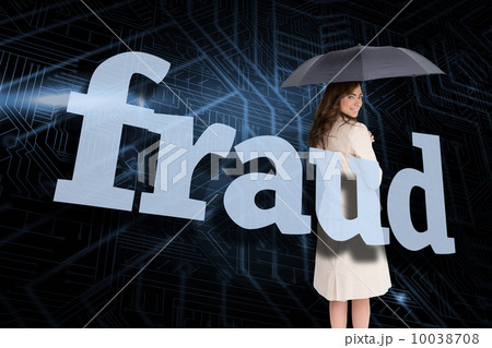 Businesswoman holding umbrella behind the word fraud 10038708