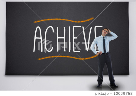 Thinking businessman against the word achieve 10039768