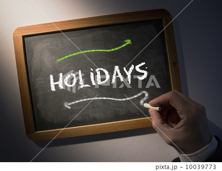 Hand writing Holidays on chalkboard 10039773