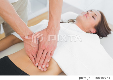 Close-up of a physiotherapist massaging woman's body Close-up of a physiotherapist massaging woman's body 10040573