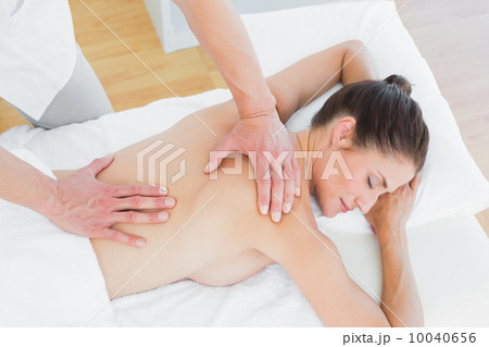 Male physiotherapist massaging woman's back Male physiotherapist massaging woman's back 10040656
