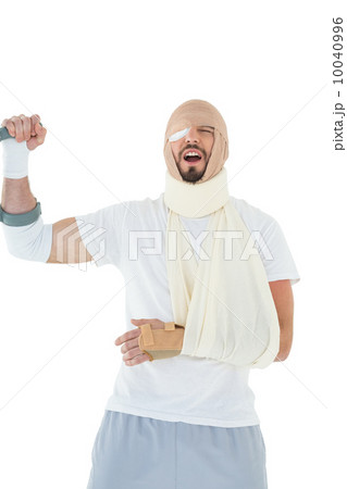 Cheerful young man with broken hand cheering 10040996