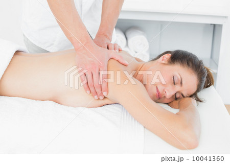 Close-up of male physiotherapist massaging woman's back Close-up of male physiotherapist massaging woman's back 10041360
