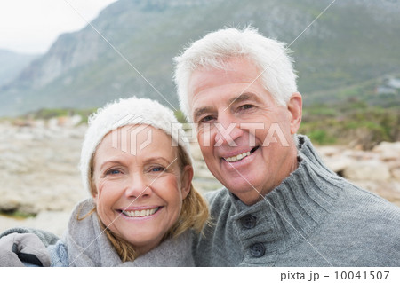 Senior couple together on rocky landscape Senior couple together on rocky landscape 10041507