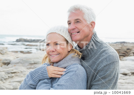 Romantic senior couple together on beach Romantic senior couple together on beach 10041669