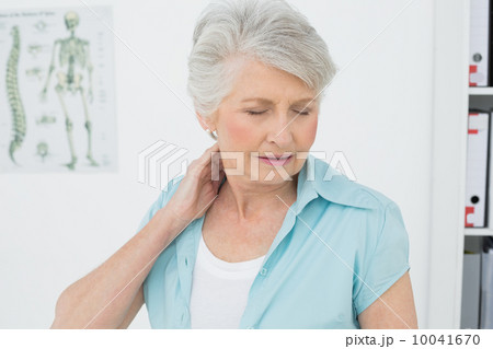 Senior woman suffering from neck pain Senior woman suffering from neck pain 10041670
