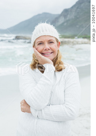 Portrait of a smiling senior woman at beach Portrait of a smiling senior woman at beach 10041697