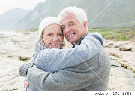 Portrait of a romantic senior couple hugging 10041882