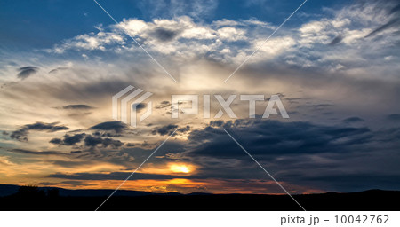 Dark storm clouds over grasslands 10042762