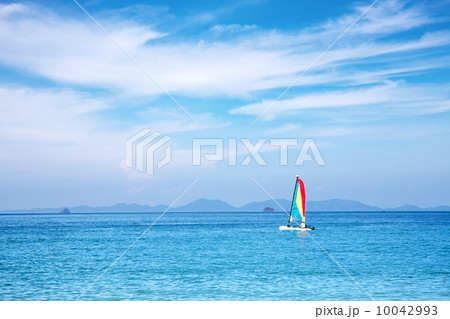 sailboat on the horizon on a sunny day 10042993