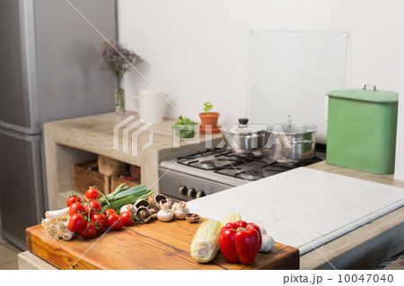 Raw vegetables on kitchen counter 10047040
