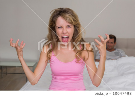 Angry woman shouting with man in bed 10047498